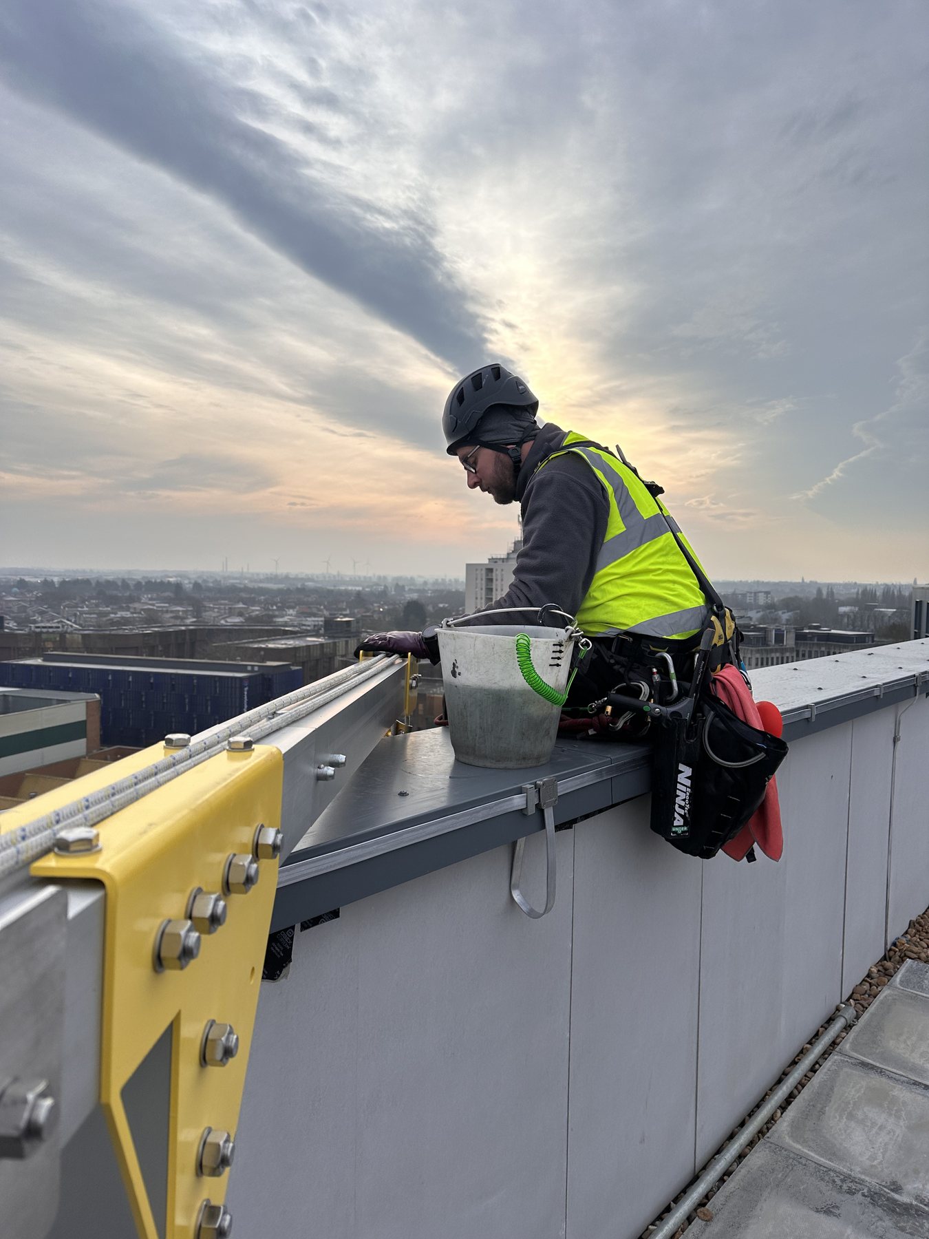 Glass restoration cleaning to remove cement residue and construction contamination