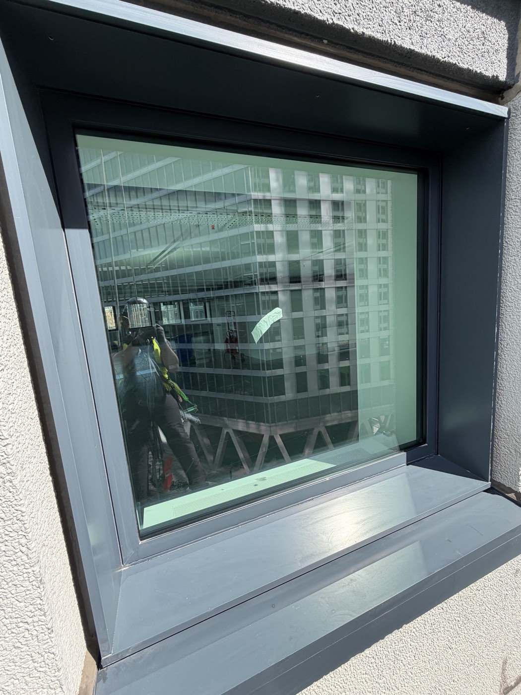 Clean window and frame after the rope access builders clean at Thirty High London